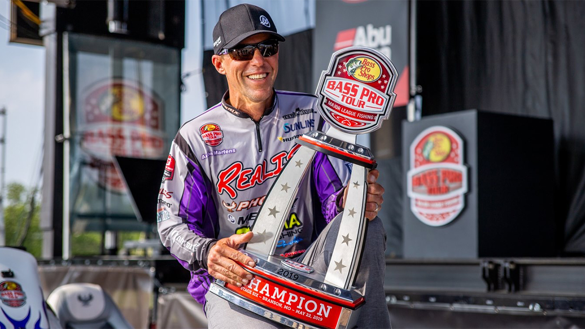 bass fisherman aaron martens holding a trophy