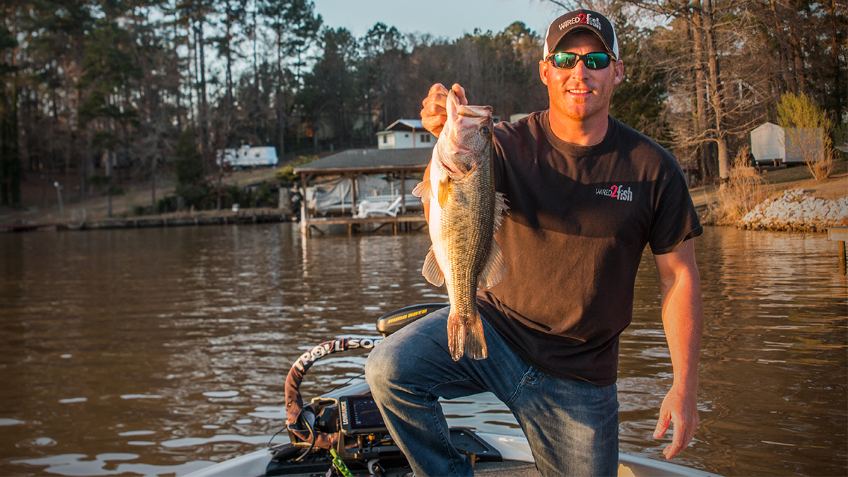 angler holding prespawn largemouth bass