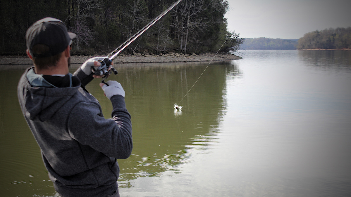 fisherman catching a bass