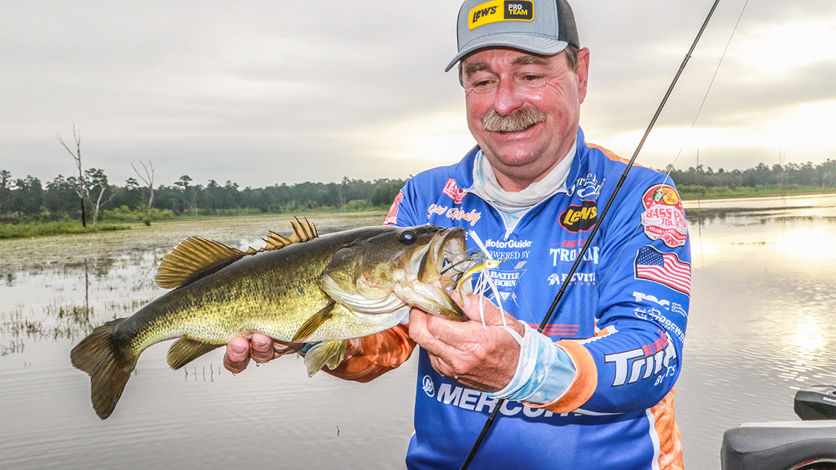 fisherman catches bass on swim jig